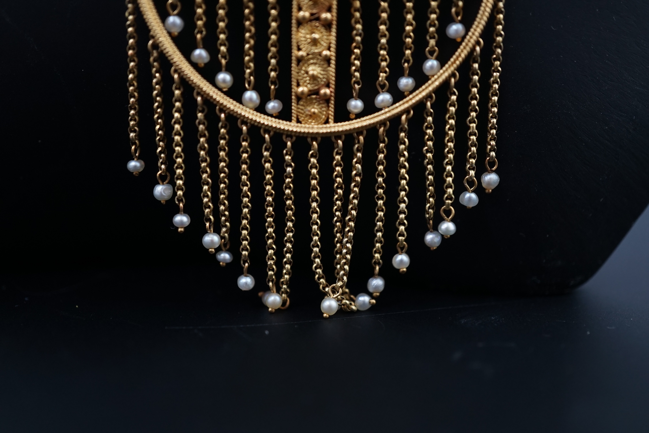 An Edwardian gold, single stone cabochon emerald and seed pearl cluster set tassel drop pendant on chain